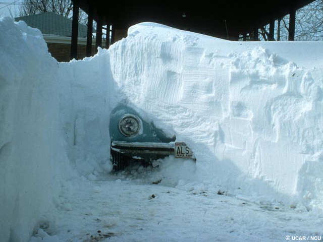 Car buried in a snowbank