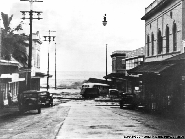 The second wave of the 1946 Alaska tsunami strikes Hilo, Hawaii.