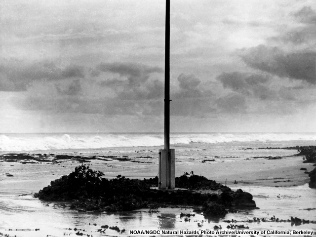 The third wave of the 1946 Alaska tsunami strikes a Hawaiian shore.