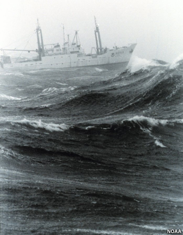 A NOAA research ship pitches on heavy sea and high waves.